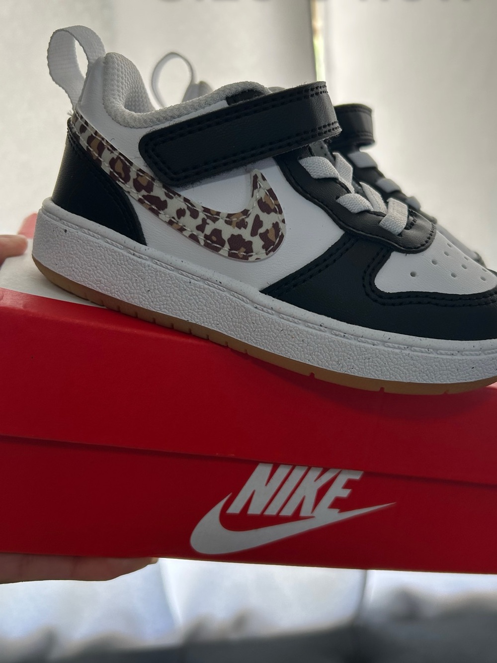 Nike Kids Low-Top Sneakers in Black, White & Brown Leopard Swoosh